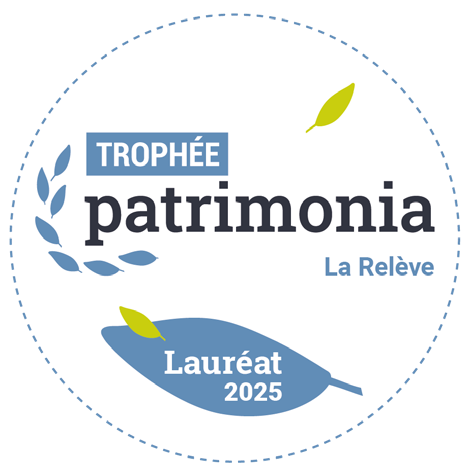 Macaron Trophée Patrimonia « La Relève » — Lauréat 2025.
